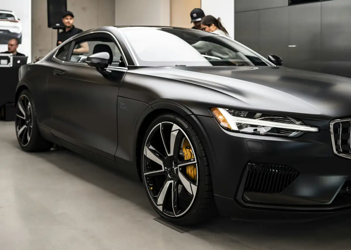 a black car is parked in a garage